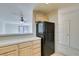 Kitchen with breakfast bar and black appliances at 2851 S Valley View Blvd # 1161, Las Vegas, NV 89102