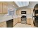 Well-lit kitchen featuring stainless steel appliances and light wood cabinets at 2851 S Valley View Blvd # 1161, Las Vegas, NV 89102