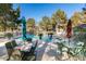 Community pool with lounge chairs, tables with umbrellas surrounded by greenery offering a relaxing atmosphere at 2851 S Valley View Blvd # 1161, Las Vegas, NV 89102