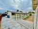 A spacious backyard with concrete patio area and a partially enclosed covered porch at 3037 Holly Hill Ave, Las Vegas, NV 89104