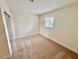Bedroom featuring neutral carpet, white walls, a window with blinds, and closet at 3037 Holly Hill Ave, Las Vegas, NV 89104