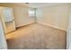 Bright bedroom featuring neutral carpet, white walls, and a window with blinds at 3037 Holly Hill Ave, Las Vegas, NV 89104