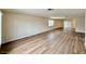 Expansive living room featuring stylish wood flooring with ample space for entertaining and everyday living at 3037 Holly Hill Ave, Las Vegas, NV 89104