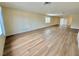 Large living room with wood floors offers a bright, open space with neutral walls, perfect for any decor style at 3037 Holly Hill Ave, Las Vegas, NV 89104