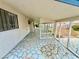 Outdoor enclosed patio featuring decorative concrete slab and sunshade at 3037 Holly Hill Ave, Las Vegas, NV 89104