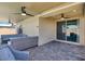 Covered back patio offering ample seating and a sliding glass door to the home at 3136 Mossfield Ave, Henderson, NV 89052