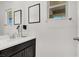 Stylish bathroom featuring modern fixtures, a sleek vanity, and ample natural light at 3136 Mossfield Ave, Henderson, NV 89052