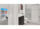 Modern bathroom featuring a glass enclosed shower, a dark vanity with a white countertop, and bright, neutral decor at 3136 Mossfield Ave, Henderson, NV 89052