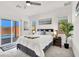 Bright bedroom with a queen bed, and sliding glass doors to a beautiful backyard pool and patio at 3136 Mossfield Ave, Henderson, NV 89052