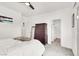 Bright bedroom featuring a ceiling fan, white walls, and a walk-in closet at 3136 Mossfield Ave, Henderson, NV 89052