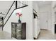 Inviting entryway with staircase and stylish decor, leading into the home's open living space at 3136 Mossfield Ave, Henderson, NV 89052