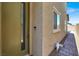 Close up of a home's front entrance with a path leading to the backyard pool at 3136 Mossfield Ave, Henderson, NV 89052