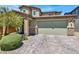 Charming two-story home with a two-car garage and an inviting brick-accented entrance at 3136 Mossfield Ave, Henderson, NV 89052