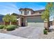Inviting two-story home with a brick-accented entrance and a well-maintained front yard at 3136 Mossfield Ave, Henderson, NV 89052