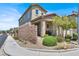 Charming two-story home featuring a brick privacy wall and landscaped front yard at 3136 Mossfield Ave, Henderson, NV 89052