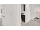 Hallway with carpeted floors leads to laundry area and bedroom with a window at 3136 Mossfield Ave, Henderson, NV 89052