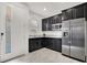 Well-equipped kitchenette featuring dark cabinets, granite countertops, and stainless steel appliances at 3136 Mossfield Ave, Henderson, NV 89052