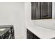 Modern laundry room equipped with a black washing machine and dryer at 3136 Mossfield Ave, Henderson, NV 89052