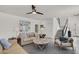 Comfortable living room with modern decor, plush seating, and a ceiling fan, creating a cozy atmosphere at 3136 Mossfield Ave, Henderson, NV 89052