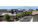 This street view showcases houses in the neighborhood with solar panels and desert landscaping at 3136 Mossfield Ave, Henderson, NV 89052