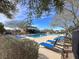 A swimming pool with lounge chairs and lush landscaping creates a relaxing community space at 3136 Mossfield Ave, Henderson, NV 89052