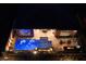 Aerial view of an illuminated pool and backyard at 33 Desert Juniper Ln, Henderson, NV 89011