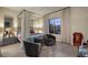 Relaxing bedroom area featuring a canopy bed, sitting area, and bright natural light at 33 Desert Juniper Ln, Henderson, NV 89011