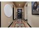 Stylish entryway with decorative rug, modern lighting, and elegant artwork at 33 Desert Juniper Ln, Henderson, NV 89011