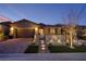 Charming single story home with meticulously landscaped front yard and brick driveway at 33 Desert Juniper Ln, Henderson, NV 89011