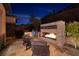 Relaxing outdoor fireplace next to a built-in grill at 33 Desert Juniper Ln, Henderson, NV 89011