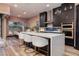 Kitchen island with breakfast bar seating and modern appliances at 33 Desert Juniper Ln, Henderson, NV 89011