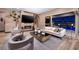 Elegant living room with comfortable seating, fireplace, and access to outdoor area at 33 Desert Juniper Ln, Henderson, NV 89011