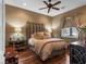 Comfortable bedroom featuring a ceiling fan, wood floors, neutral walls, and natural light at 330 Rancho Cir, Las Vegas, NV 89107