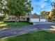 Spacious home featuring a three-car garage, well-manicured lawn, and inviting curb appeal at 330 Rancho Cir, Las Vegas, NV 89107