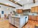 Open kitchen featuring a large island, custom cabinetry, and views to the breakfast area at 330 Rancho Cir, Las Vegas, NV 89107