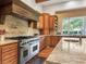 Gourmet kitchen featuring granite counters, stainless steel appliances, and wood cabinets at 330 Rancho Cir, Las Vegas, NV 89107