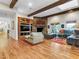 Inviting living room with hardwood floors, exposed beams, and a stone fireplace at 330 Rancho Cir, Las Vegas, NV 89107