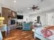 Large main bedroom featuring wood floors, sitting area with fireplace, and a view of the backyard at 330 Rancho Cir, Las Vegas, NV 89107