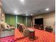 Home theater with tiered seating, recliner chairs, large screen TV, and plush carpeting at 330 Rancho Cir, Las Vegas, NV 89107