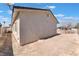 Large backyard surrounded by block wall, offering privacy and potential for customization at 3409 Judson Ave, North Las Vegas, NV 89030