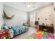 Fun bedroom featuring ceiling fan, bright decor, and a playful atmosphere at 3409 Judson Ave, North Las Vegas, NV 89030