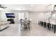 Bright, open-concept space showcasing dining area leading to a living room and stylish kitchen at 3409 Judson Ave, North Las Vegas, NV 89030