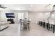 Bright, open-concept space showcasing dining area leading to a living room and stylish kitchen at 3409 Judson Ave, North Las Vegas, NV 89030