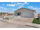 Charming single-story home with a well-manicured lawn and white picket fence at 3409 Judson Ave, North Las Vegas, NV 89030