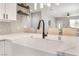 This kitchen features white counters, sink, cabinetry, and stainless appliances at 3409 Judson Ave, North Las Vegas, NV 89030