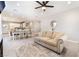 Spacious living room blending into the dining area, showcasing an open-concept design with light wood floors at 3409 Judson Ave, North Las Vegas, NV 89030
