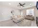Bright living room featuring neutral tones, comfortable sofas, and light-colored wood flooring at 3409 Judson Ave, North Las Vegas, NV 89030