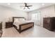 This main bedroom features a ceiling fan, a window, and neutral decor at 3409 Judson Ave, North Las Vegas, NV 89030