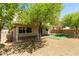 Backyard featuring covered patio and artificial turf at 3809 Alpine Track Ave, North Las Vegas, NV 89032
