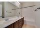 Bathroom with double sinks, white countertops, and a shower and tub combo at 3809 Alpine Track Ave, North Las Vegas, NV 89032